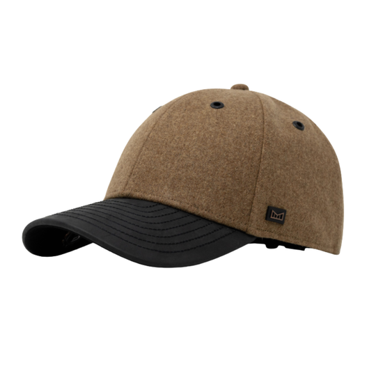 A structured baseball cap made of textured brown felt-like fabric with a black curved brim, shown on a plain white background. A small black square logo patch is visible on the side of the brim.