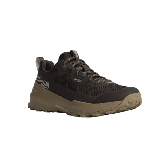 A single trail running shoe in dark brown and black with a tan sole, shown from a side profile on a white background.