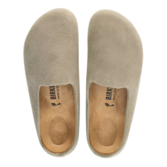 A pair of Birki slip-on clogs in a light taupe suede-like material, shown from a top-down view on a white background.