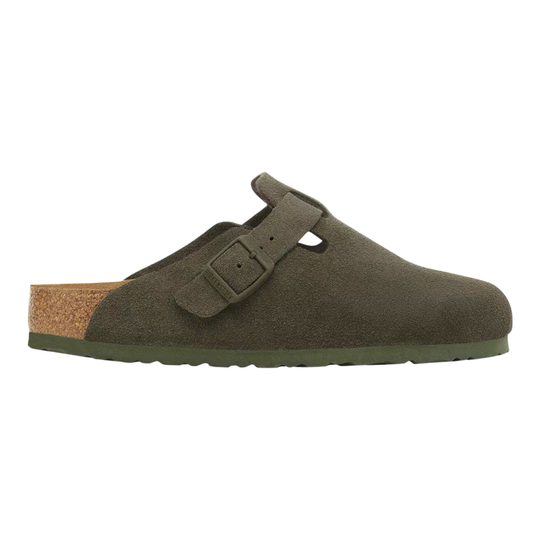 An olive green clog shoe with a suede-like finish, featuring a single adjustable strap with a buckle closure, a cork-look midsole, and a solid green outsole, shown against a plain white background.