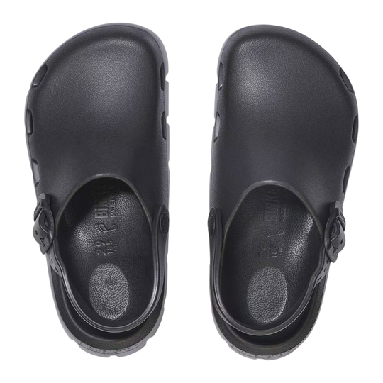Pair of black clogs-style shoe with a thick lug sole and a strap closure, shown on a plain white background.