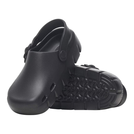 Pair of black clogs-style shoe with a thick lug sole and a strap closure, shown on a plain white background.