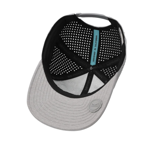 A structured baseball cap shown from an angled top-down view, featuring a light gray brim and a black perforated mesh back panel with a small teal vertical label.