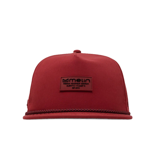 A red flat-brim snapback cap with a rectangular brown leather patch on the front displaying the 'melt' brand logo, set against a plain white background.