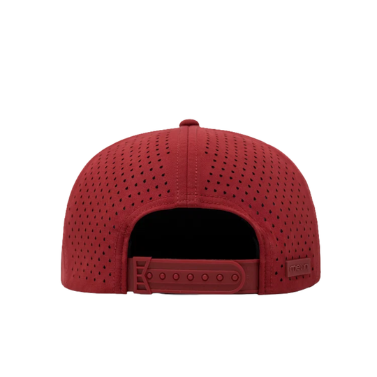 A red structured snapback cap shown from the back, featuring a perforated fabric design and an adjustable strap with a small brand tag on the side.