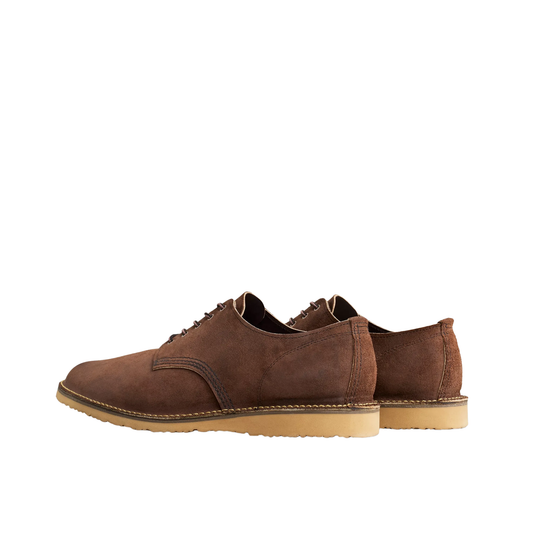 A pair of men's brown suede lace-up shoes with contrast stitching and tan soles, photographed on a clean white background.
