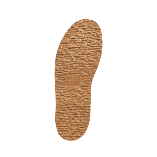 Tan Red Wing sole on a plain white background