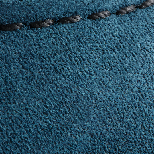 close up of the blue leather suede material with a black stich 