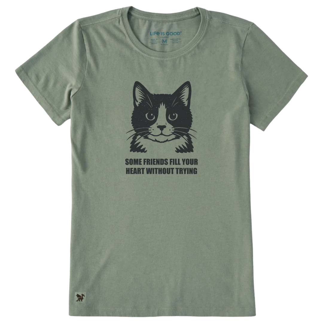 An olive green short-sleeve t-shirt with a black graphic of a cat's face and the text 'SOME FRIENDS FILL YOUR HEART WITHOUT TRYING' printed on the chest.