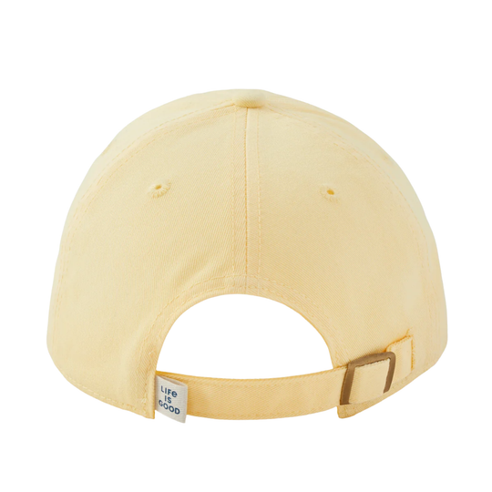 The back view of a pale yellow baseball cap with an adjustable strap and a small white brand tag that reads 'LIFE IS GOOD'.