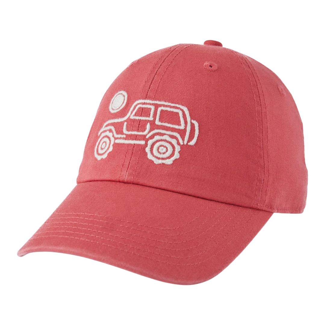 A coral red baseball cap featuring a white embroidered line-art graphic of a car and moon on the front panel, set against a plain white background.