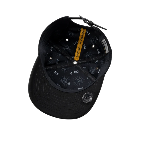 Black structured baseball cap shown from an overhead angle, featuring a black patterned interior, a yellow 'DESIGNED IN California' tag.