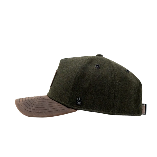 Green wool cap on a white background