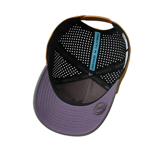 A trucker-style baseball cap shown from a top-down angle, featuring a purple visor, black mesh back panels, a brown leather-look side panel, and a blue interior label.