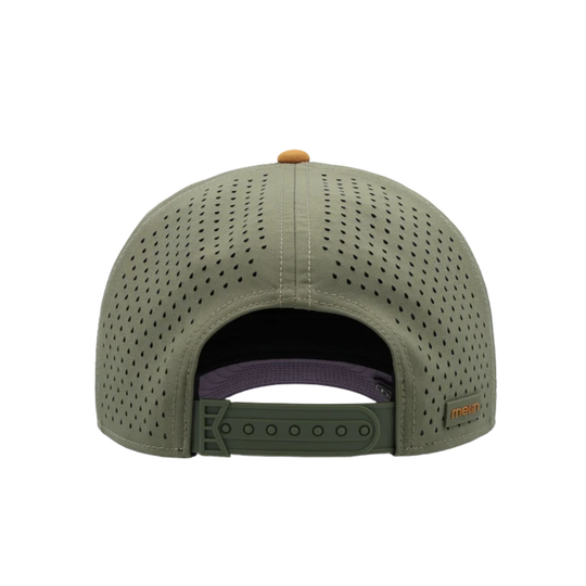 The back view of an olive green perforated snapback cap with a purple interior lining and a small orange brand tag on the side, set against a plain white background.