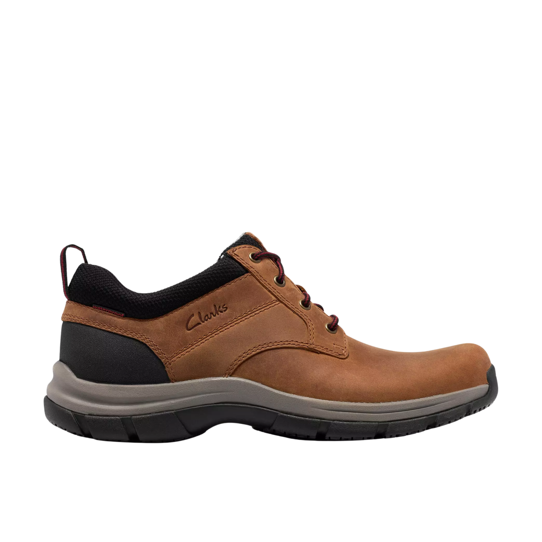 A single brown leather lace-up shoe by Clark's, featuring a black collar, black heel cap, and a gray and black midsole, shown in a side profile on a white background.