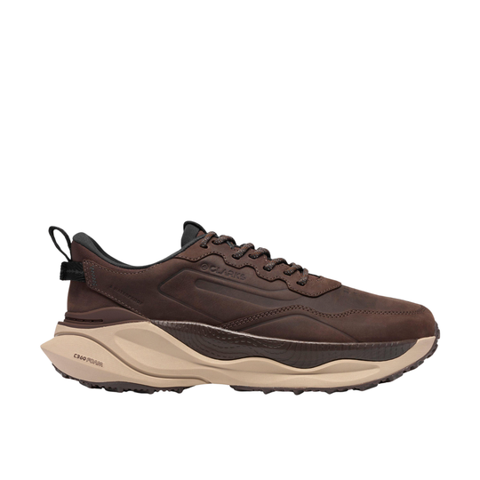 A brown leather sneaker with a thick beige and dark brown chunky sole, shown from a side profile on a white background.