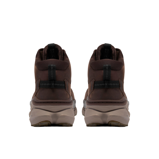 A pair of dark brown mid-height hiking boots shown from the back, featuring black heel pull tabs and thick beige and brown midsoles, set against a plain white background.