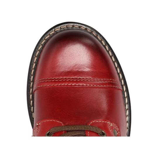 A close-up top-down view of a red leather boot toe, showing the polished leather surface, decorative stitching, and edge of the sole against a white background.