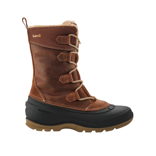 A brown KAMIK winter boot with a black rubber toe cap and sole, tan laces, and a light brown faux-fur lining, shown against a plain white background.