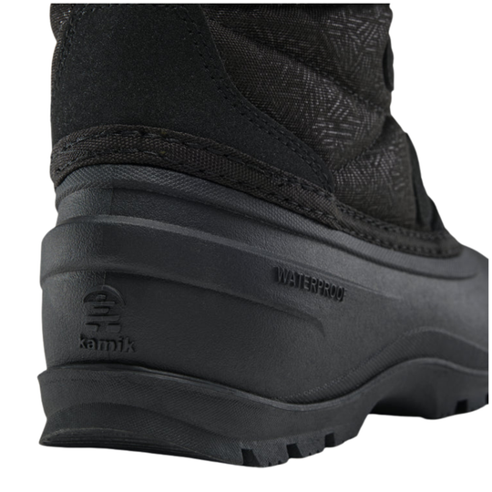 Close-up of the side and heel of a black waterproof ankle boot, showing the embossed Kamik logo and 'WATERPROOF' text on the sole.