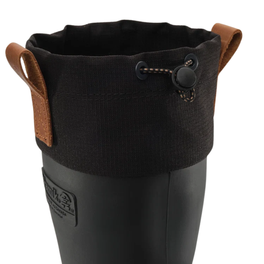 Close-up of a black rubber rain boot with a black fabric cuff and brown leather pull tabs, shown on a white background.