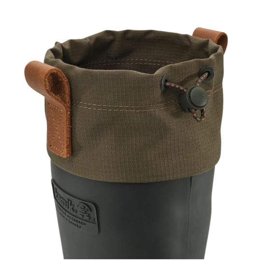 Close-up of a dark gray rubber boot with an olive green canvas cuff featuring brown leather handles and a drawstring closure.