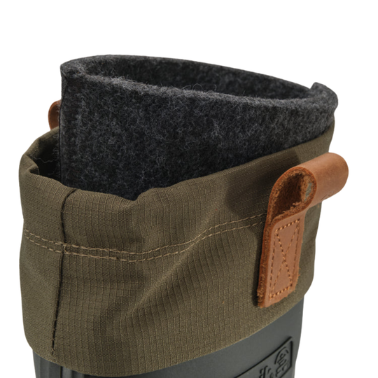 Close-up of a boot cuff with an olive green fabric sleeve, a dark gray felt lining, and a tan leather pull tab on a light gray background.
