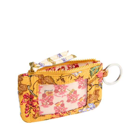 A small zippered card holder or coin purse with a floral print, featuring a clear ID window, gold zipper, and a silver key ring on a white background.