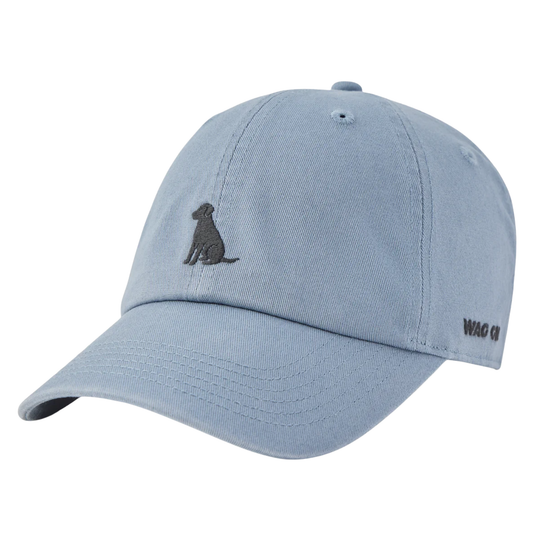 A light blue dad hat baseball cap featuring a dark gray embroidered dog silhouette on the front and 'Wag on' text on the side, shown against a plain white background.