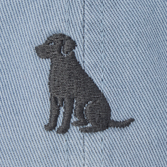 Embroidered black dog design on light blue denim fabric