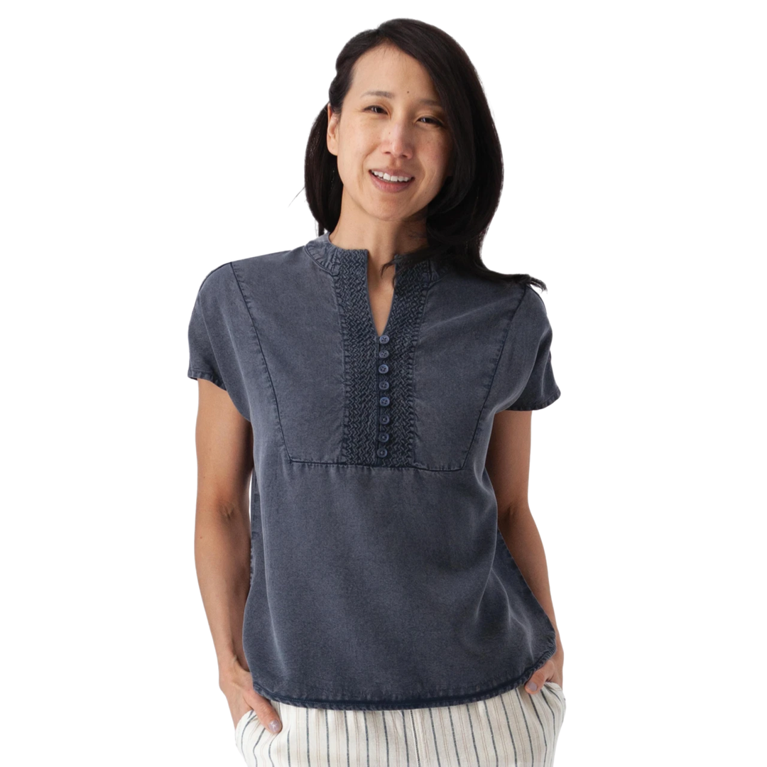 Woman wearing a blue shirt on a white background