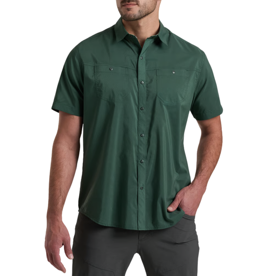 Man wearing a green short-sleeve shirt on a white background