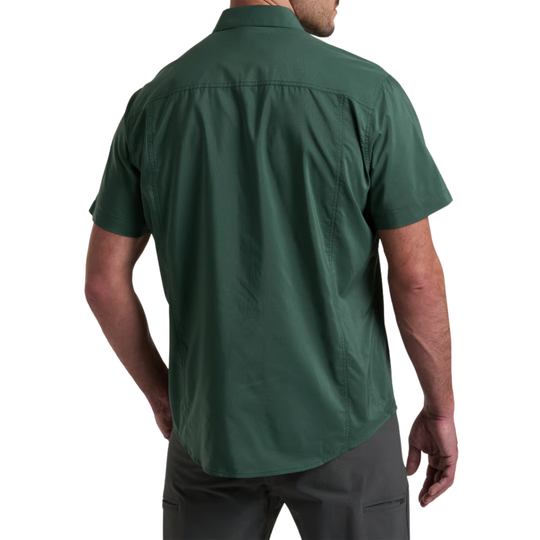 A man wearing a dark green short-sleeve button-up shirt, shown from the back against a plain white background.