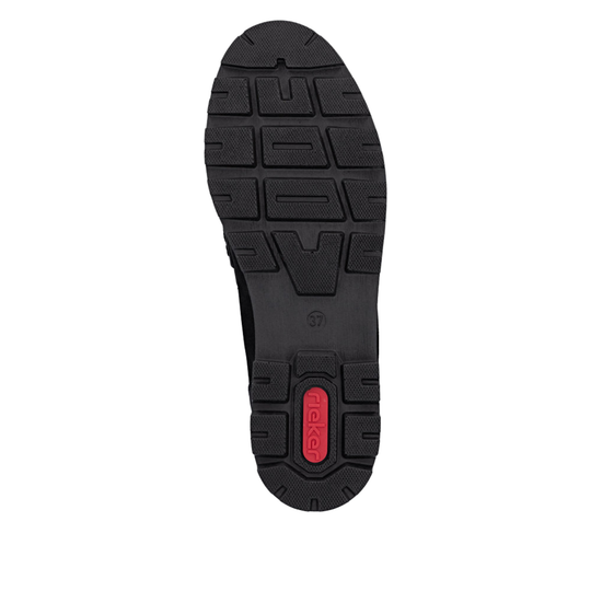 A top-down view of a black shoe sole with a textured tread pattern and a small red heel accent featuring the brand name 'Rieker'.