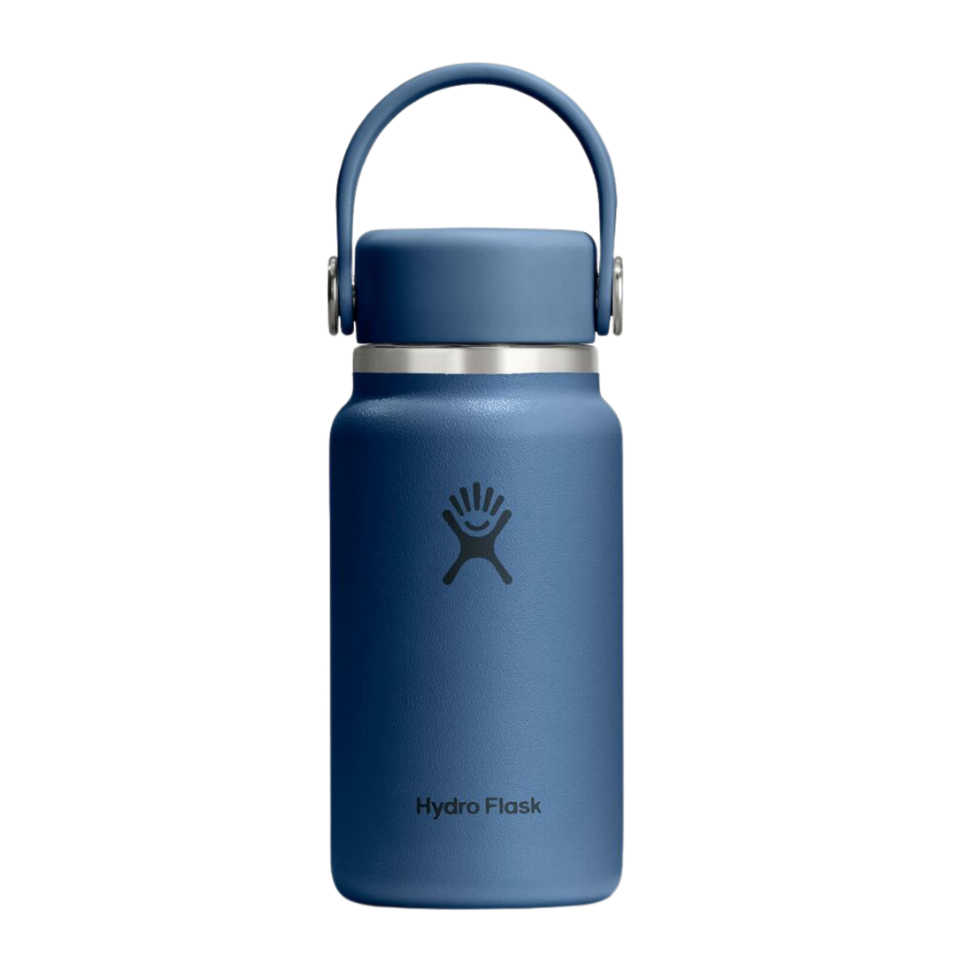 Blue Hydro Flask water bottle with a handle on a white background