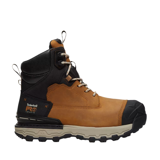 A Timberland Pro work boot in brown and black leather with a beige sole, shown from a side profile view on a white background.