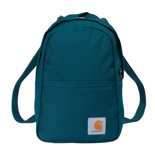 A teal Carhartt canvas backpack with a front zippered pocket and a white Carhartt brand patch on the lower right, shown against a plain white background.