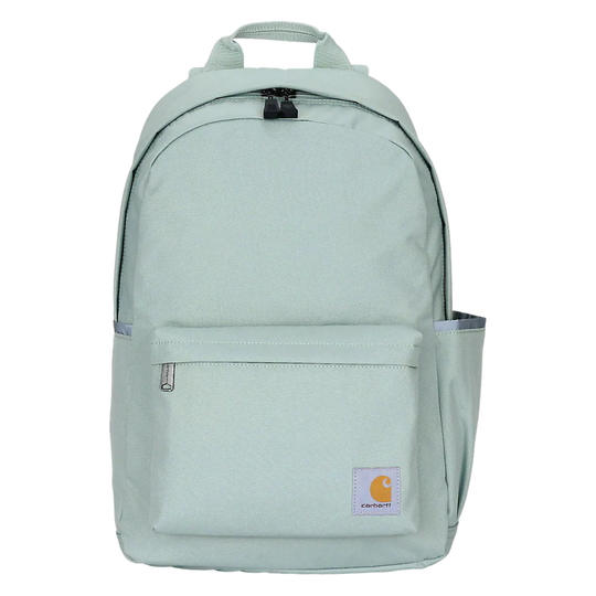 A light sage green Carhartt backpack with a front zippered pocket and a small Carhartt brand patch on the lower right corner, shown against a plain white background.