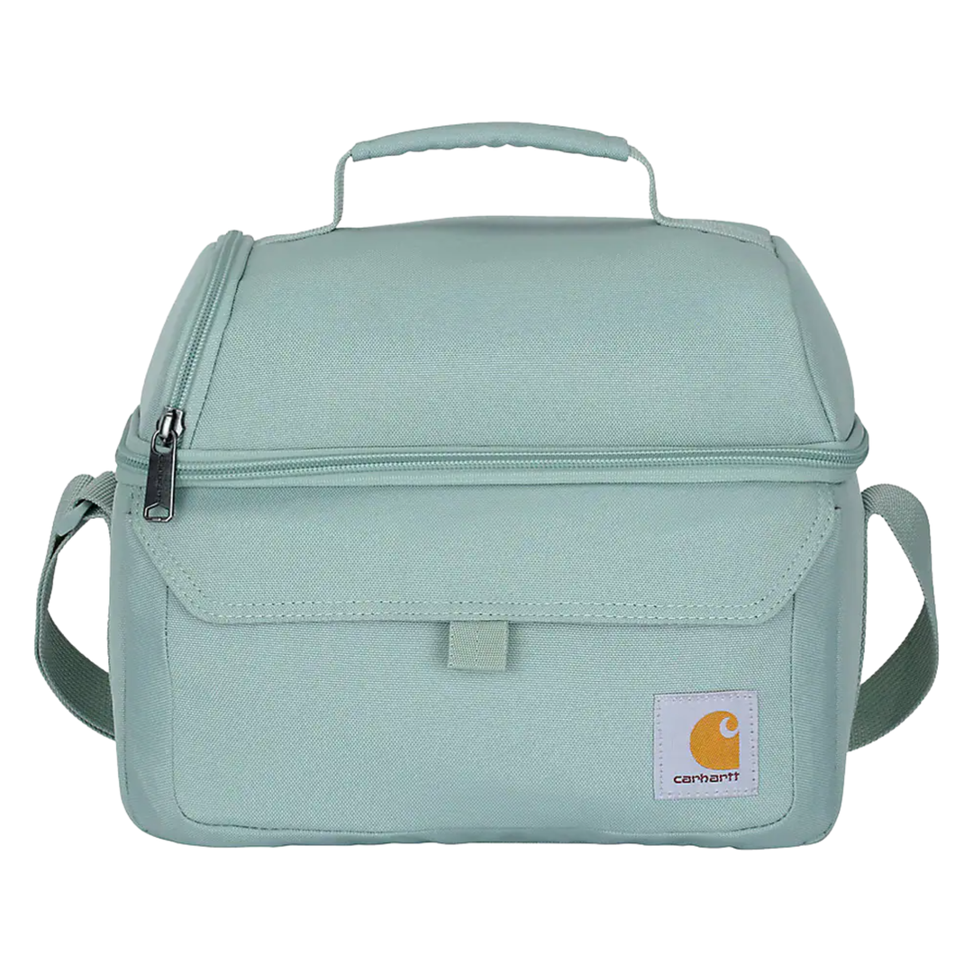 A light mint green fabric camera bag with a top handle, front zippered pocket, and an adjustable shoulder strap, shown against a plain white background.