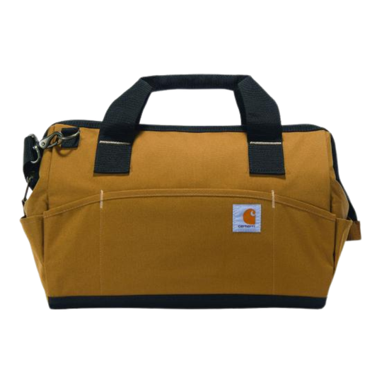 A Carhartt tool bag in a classic mustard yellow canvas with black webbing handles, a black base trim, and a white Carhartt logo patch on the front pocket.
