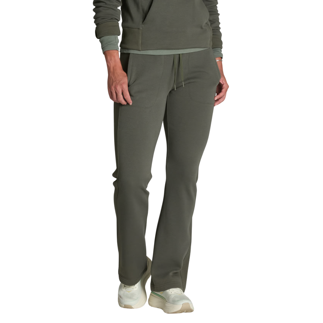 A person wearing olive green drawstring sweatpants and a matching olive green top, shown from the chest down against a plain white background.