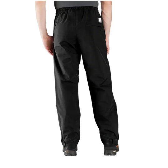 Black pants worn by a person on a white background