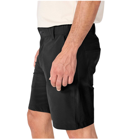 A close-up side view of a person wearing black work shorts with a white shirt partially visible, against a plain white background.