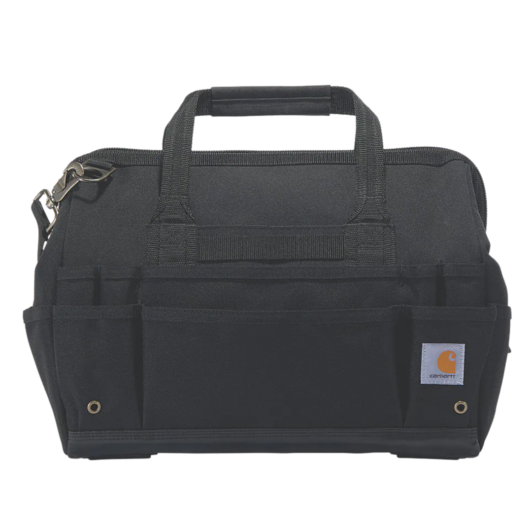 A black Carhartt tool bag with multiple front utility pockets, top carry handles, and a small Carhartt brand patch on the lower right front, shown against a plain white background.