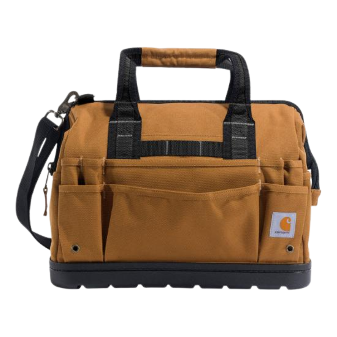 A Carhartt utility tool bag in brown canvas with black trim, dual top handles, a shoulder strap, and multiple front utility pockets, shown on a plain white background.