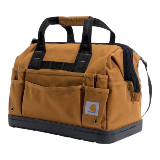 A brown canvas tool duffel bag with black handles, a black base, and multiple front utility pockets, featuring a visible Carhartt logo patch on the front pocket.