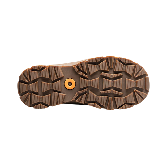 The treaded outsole of a brown boot or shoe, viewed from the bottom, featuring a textured pattern and a small orange circular accent in the center, isolated on a white background.