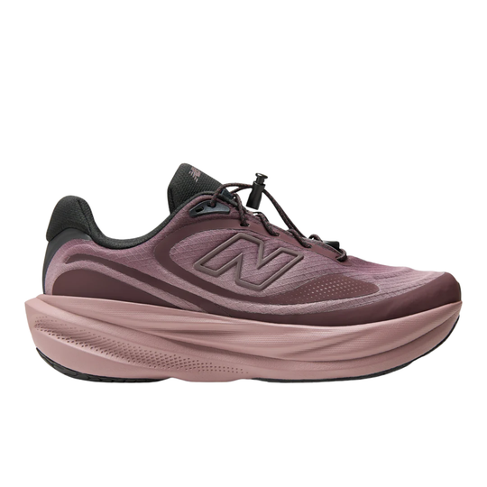 A New Balance running shoe in a dusty mauve and burgundy colorway, featuring a thick, cushioned pinkish-brown sole and a dark gray 'N' logo on the side, shown against a plain white background.