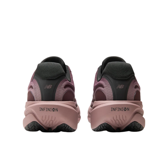 A New Balance running shoe in a dusty mauve and burgundy colorway, featuring a thick, cushioned pinkish-brown sole and a dark gray 'N' logo on the side, shown against a plain white background.